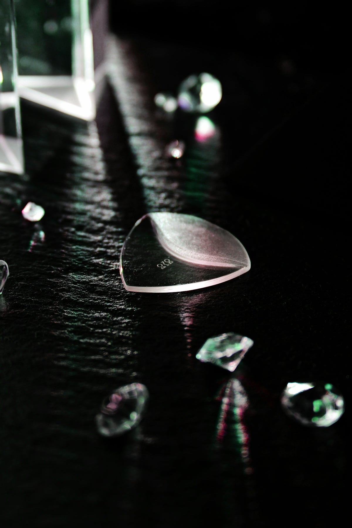 a table topped with lots of glass vases filled with water